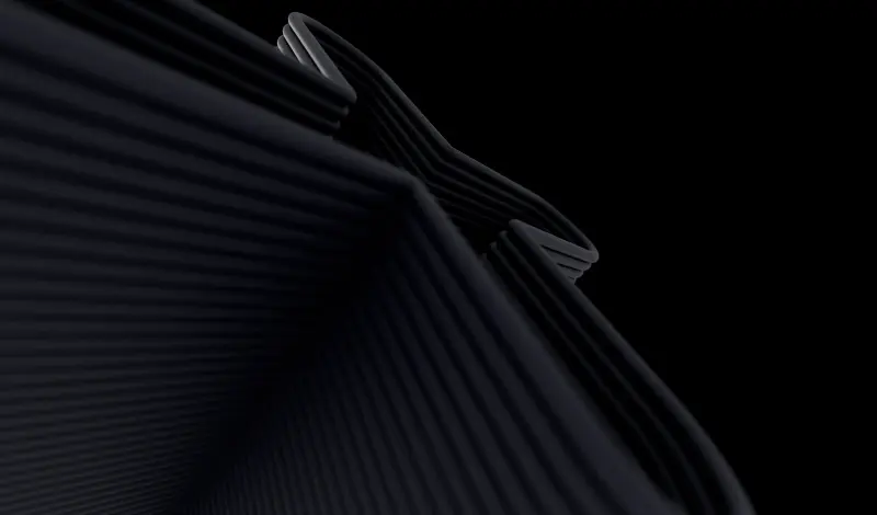 Black 3D layered abstract structure on a dark background, forming curved and angled shapes