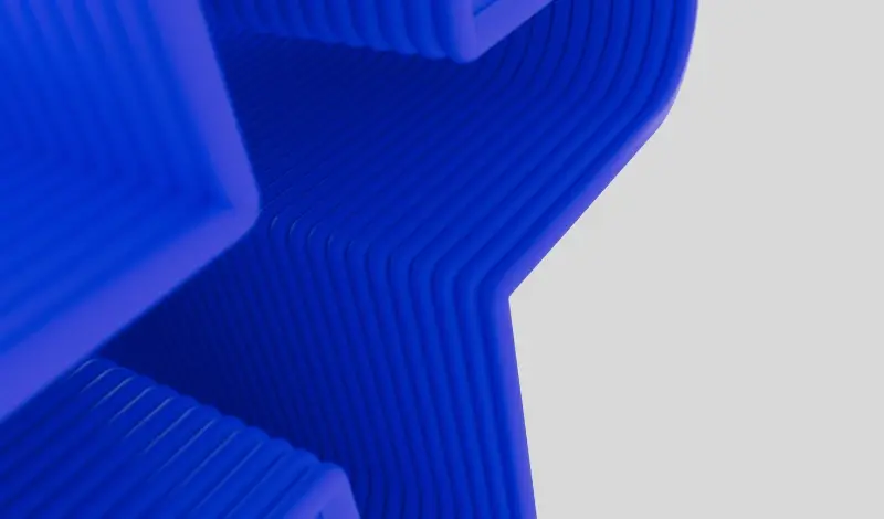 3D blue layered abstract form creating a stylised star-like shape on a light grey background